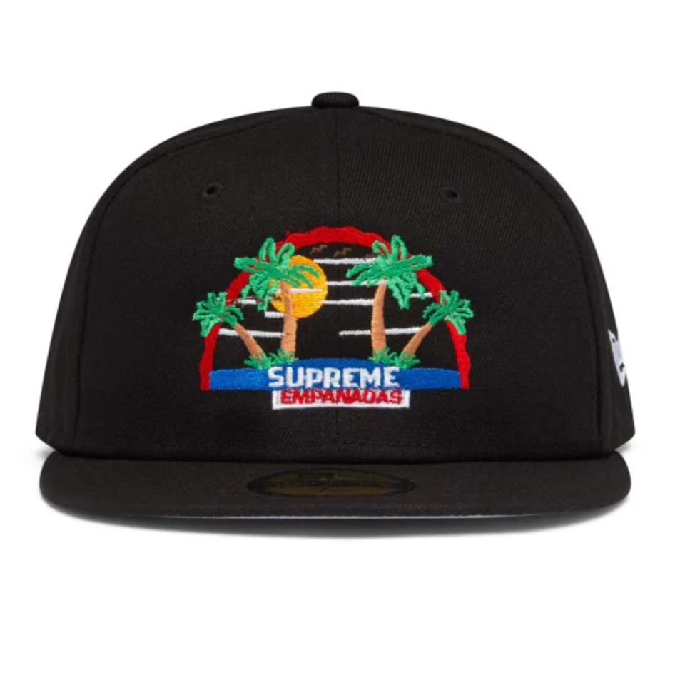 Black baseball cap with an embroidered logo of palm trees, sun, and "Supreme Empanadas" text.